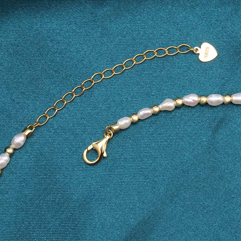 gold necklace with pearl beads